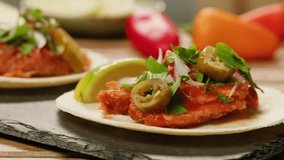 Traditional mexican food tacos with jalapeno pepper on the top close-up. Homemade tacos with meat and vegetables  - Powered by Shutterstock - Get 15% off with code: PIKWIZARD15