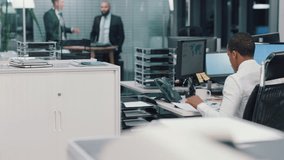 Black man, smile and phone call conversation in office, business or communication. Trader, stock market and telephone for talking, happy or working for startup trading company or relax in work chair - Powered by Shutterstock - Get 15% off with code: PIKWIZARD15