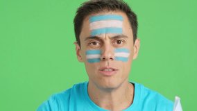 Close up of a man supporting argentine team