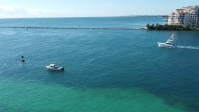 Boat sailing off the coast of miami beach. Video made in Miami, FL, USA in 18 Oct 2023.