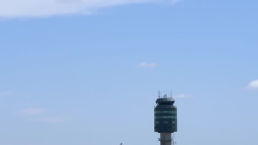 Airport Scene with Aircraft Flying Behing Air Traffic Control Tower 4K