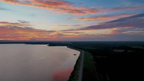 top view motion video of beautiful colorful clouds, Majestic sunset sky landscape. sky from Nam Oon Dam, Phang Khon, Sakon Nakhon, Thailand.