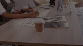 Animation of stock market data processing over mid section of a woman using graphic tablet at office. Global economy and business data technology concept - Powered by Shutterstock - Get 15% off with code: PIKWIZARD15