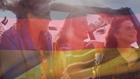 Composite video of waving germany flag over group of diverse friends toasting beers in the car. Patriotism, road trip and camping concept