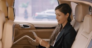 Business woman, phone and video call in car, thinking or wave hello to contact, web chat or networking. Entrepreneur, smartphone and webinar for talking in taxi for travel, transportation and traffic