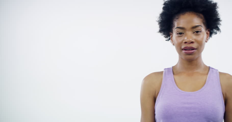 Woman, smile and pointing in portrait for workout, personal trainer and promotion for wellness. Black female model, training and invite in mockup, motivation and happy in studio by white background