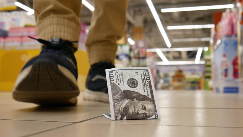A lost hundred dollar bill lying on the floor of a supermarket and a random shopper finds it