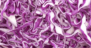 4K footage Close-up Rotating  Macro shot top view texture Purple cabbage cut into pieces, food concept.