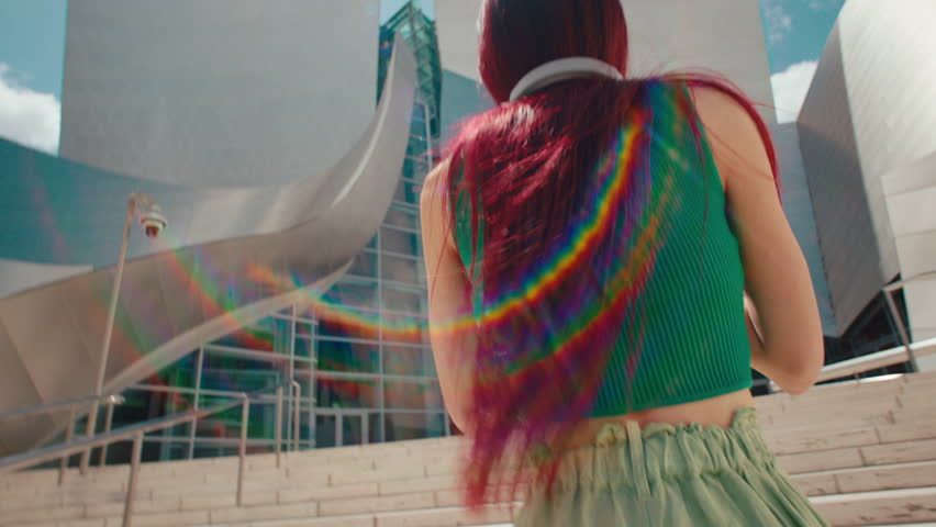 Asian redhead Girl enjoying the music outdoors