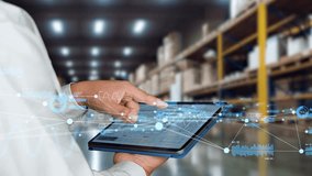 Engineers using tablet at a distribution warehouse and digital network concept. - Powered by Shutterstock - Get 15% off with code: PIKWIZARD15