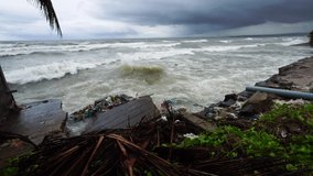 Rising Sea Levels Battering The Coastal Areas Of Thailand With Trash And Debris; Visible Signs Of Global Warming And Climate Change Taking A Toll On The Environment. - Powered by Shutterstock - Get 15% off with code: PIKWIZARD15