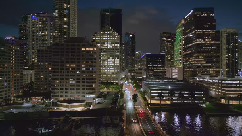 Aerial drone view of Miami Macarthur Causeway Bridge to the beach at night, Florida, USA Royalty-Free Stock Footage #1110363531
