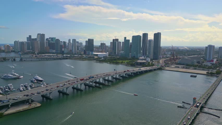 Aerial forward shot of Miami Macarthur Causeway Bridge to the beach, Florida, USA Royalty-Free Stock Footage #1110363727