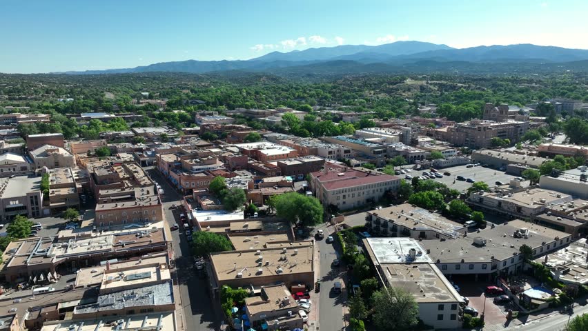 Aerial view of Santa Fe, showcasing the distinct adobe buildings and panoramic mountain vistas.