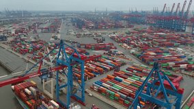 Drone shot of modern industrial port of Hamburg with containers from top view or aerial view. It is an import and export cargo port where is a part of shipping dock - Powered by Shutterstock - Get 15% off with code: PIKWIZARD15