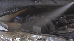Washing and Cleaning the Car Engine After Service in the Repair Shop Footage.