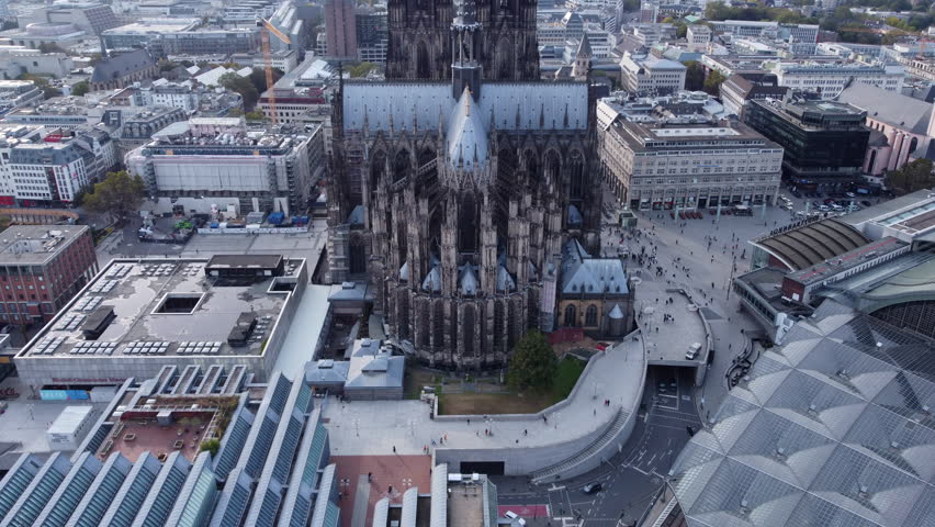 Tilt-up Reveal Of Cologne Cathedral Twin Spires From Apse Side Exterior. Cologne, Germany. aerial