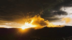 dynamic shifting sunset and fast-moving atmospheric clouds over a town in Colorado vibrant sunset hyper lapse AERIAL STATIC