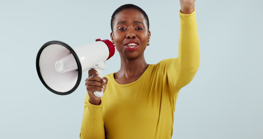 Happy black woman, megaphone and pointing to you in winning, prize or sale against a studio background. Portrait of African female person smile with bullhorn or loudspeaker for choice or selection Royalty-Free Stock Footage #1110391101