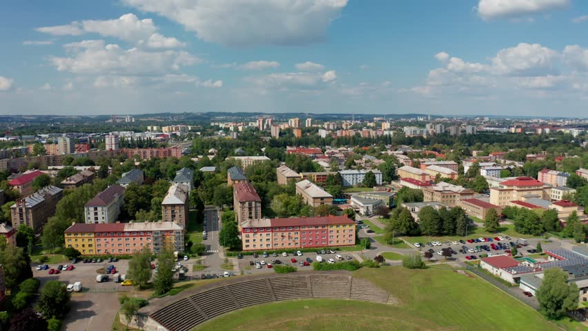 Aerial drone shot of a czech big city Ostrava with buldings, cars, roads and apartments during summer