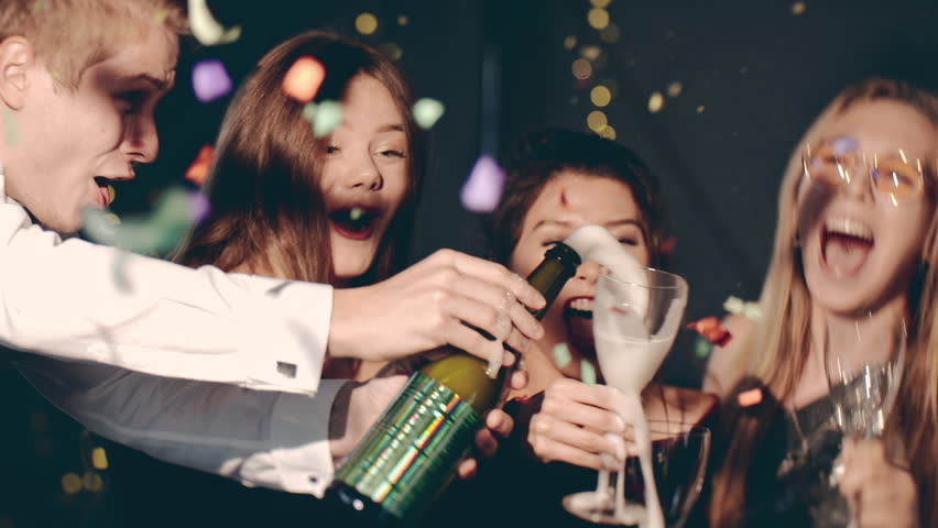 Group of stylish friends celebrating at glamorous merry Christmas new year party event making toast drinking champagne at formal social gathering enjoying evening celebration at Eve winter night. | Shutterstock HD Video #1110395273