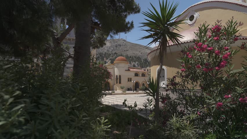 Shrubs in front of Sainte Eglise de la Transfiguration du Christ Sauveur (Metamorfosi Sotiros Cathedral), Kalimnos Town, Kalimnos, Dodecanese, Greek Islands, Greece, Europe