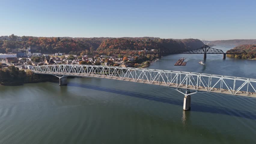 A high, wide aerial view of bridges and ships on the Ohio River in Beaver County, Pennsylvania.  	