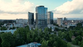 4k Aerial drone footage of Millennium Centre in Sofia, Bulgaria at sunset. High angle shot of skyscraper in an urban environment. 