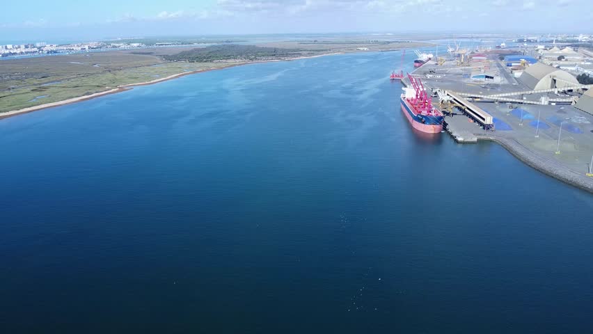 Aerial drone view of a Bulk Carrier Moored in the industrial outer port of Huelva, Palos de la Frontera, Spain