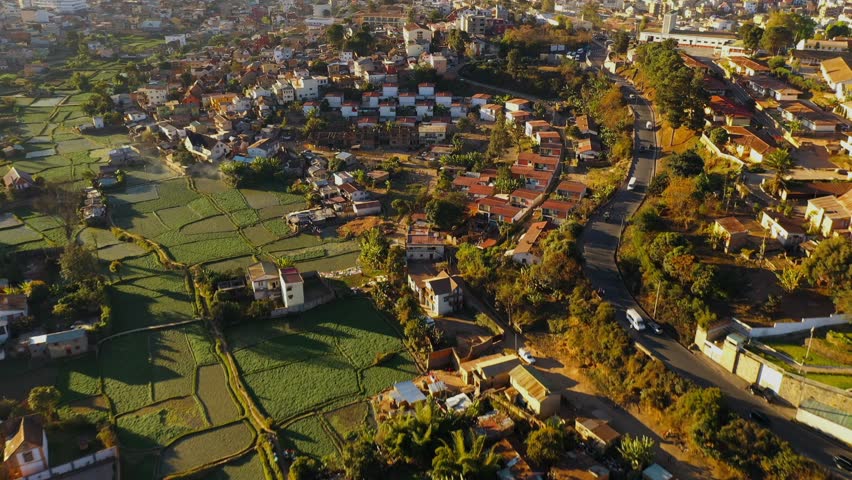 Aerial view of Antananarivo, beautiful and colourful town on the hillside at sunset, Analamanga, Madagascar. Royalty-Free Stock Footage #1110415467