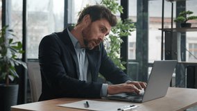 Busy multitasking caucasian businessman manager consultant talking on phone writing notes checking information on laptop frustrated man entrepreneur dissatisfied male client arguing using smartphone - Powered by Shutterstock - Get 15% off with code: PIKWIZARD15