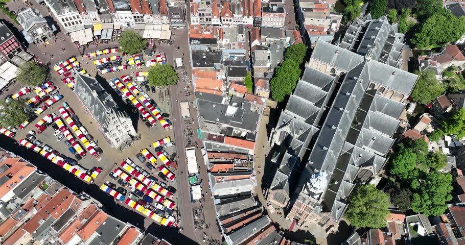 Aerial drone view of the city center of Gouda, including Sint-Janskerk, Stadhuis van Gouda, cityhall, and the market square