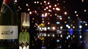 2024 Champagne Bottle and Golden Glasses with glowing city lights background, luxury New Year's Eve Concept  3d rendering - Powered by Shutterstock - Get 15% off with code: PIKWIZARD15