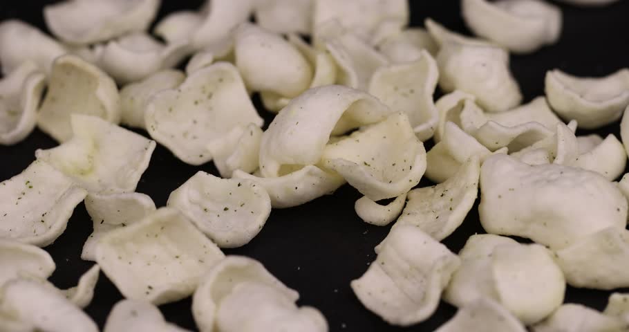 potato chips made of mashed potatoes with spices, delicious but harmful chips made of mashed potatoes and fragrant herbal spices