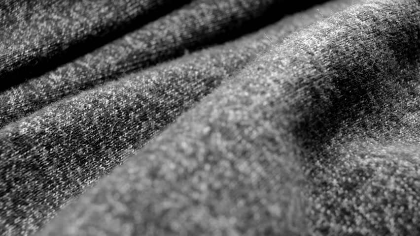 Close-up of dark gray cotton fabric. Dolly slide shot. 50 frames per second. You can slow down this frame if necessary Royalty-Free Stock Footage #1110436003