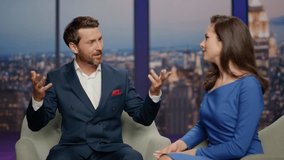 Anchorwoman listening man guest in live tv show studio close up. Happy bearded male expert answering on interview questions from host. Two professional presenters hosting entertainment program in air. - Powered by Shutterstock - Get 15% off with code: PIKWIZARD15