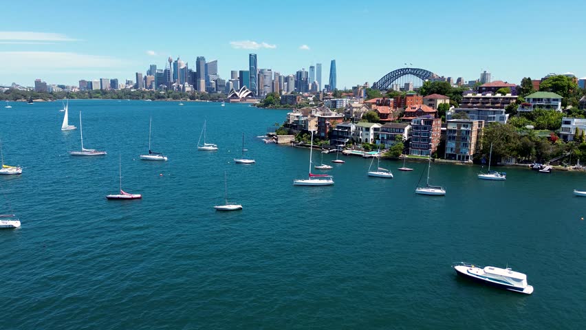 Drone aerial landscape scenic view Cremorne Point Neutral Bay Mosman Sydney City CBD skyline Harbour yachts apartment buildings real estate NSW Australia 4K