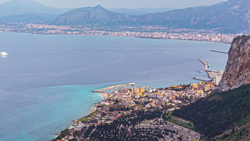 Cityscape of Palermo with bay and vessel sailing in, view from mountains