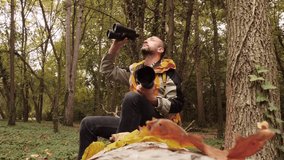 Man using binoculars and camera for birdwatching and other observing animals in nature. - Powered by Shutterstock - Get 15% off with code: PIKWIZARD15