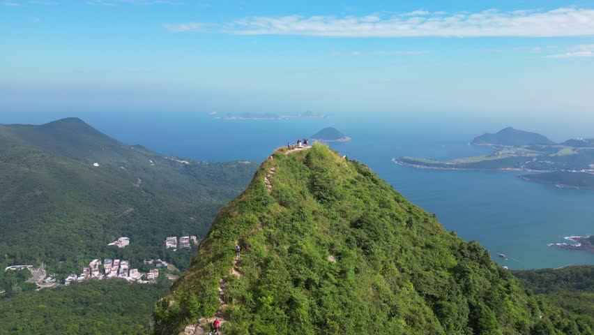 Sai Kung, Hong Kong: Aerial drone footage of the High Junk Peak in the new territories of Hongkong with the stunning beach of clear water bay in the background. 