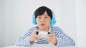 Boy playing video games while voice chatting. - Powered by Shutterstock - Get 15% off with code: PIKWIZARD15