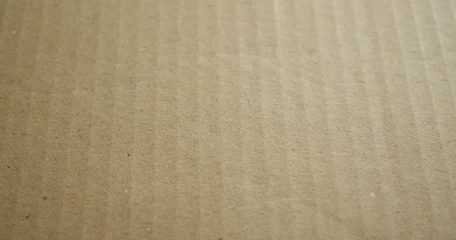 Hands applying MADE IN ITALY flag label on a shipping box with product premium quality barcode. Manufacturing and delivery. Product factory import and export.
