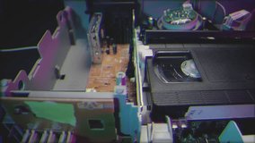 Retro Neon VHS Tape Playing in a VCR Dolly Dynamic Filter - Powered by Shutterstock - Get 15% off with code: PIKWIZARD15