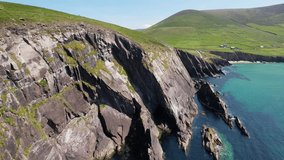 Ireland- 8.27.2023 -excellent aerial footage panning from the green coast of dingle, ireland to the ocean.