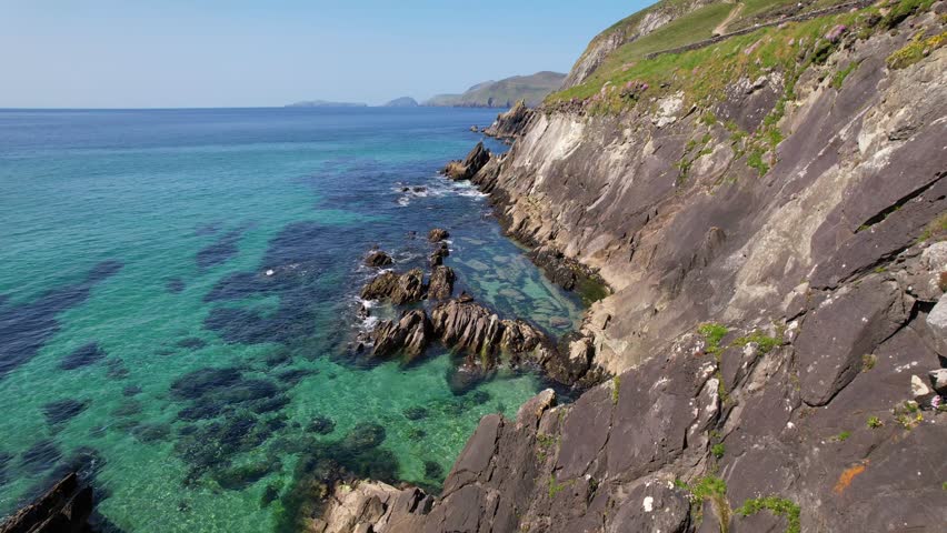 Ireland- 8.27.2023 -excellent aerial footage moving along the rocky cliffside of dingle, ireland.
