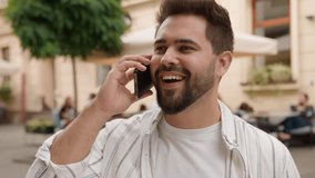Caucasian male businessman talking cellphone smiling laughing man casual talk mobile phone business call outdoors close up happy guy discuss news friend smartphone communication on city street outside - Powered by Shutterstock - Get 15% off with code: PIKWIZARD15