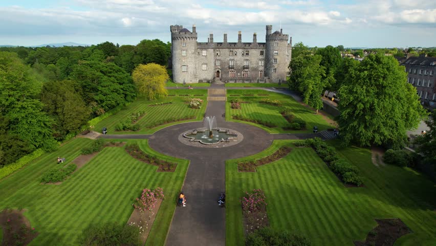 Ireland - july.27.2023 - excellent aerial footage raising up from the grounds of kilkenny castle in kilkenny, ireland.