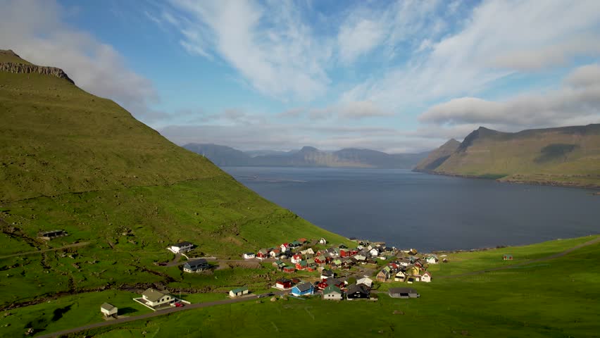 Faroe islands - july.16.2023 - excellent aerial footage of a village on the coast of funningur in the faroe islands. | Shutterstock HD Video #1110477217