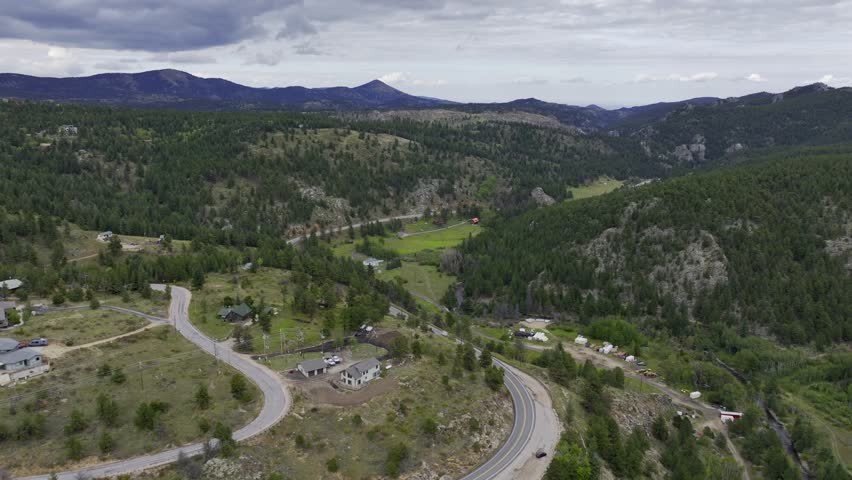 Aerial footage of the Rocky Mountains in Nederland Colorado. Footage includes the Barker Meadow Reservoir, the Barker Dam and surrounding mountain landscape. Video taken on a cloudy September day.