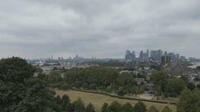 Drone shot when ascending over Greenwich park on a cloudy day. - Powered by Shutterstock - Get 15% off with code: PIKWIZARD15